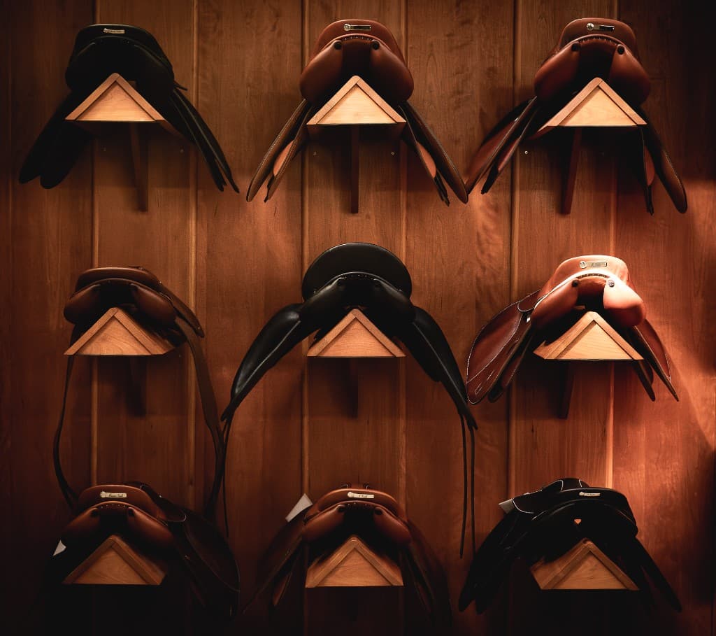 Butet saddles on the wall, showing leather and color range